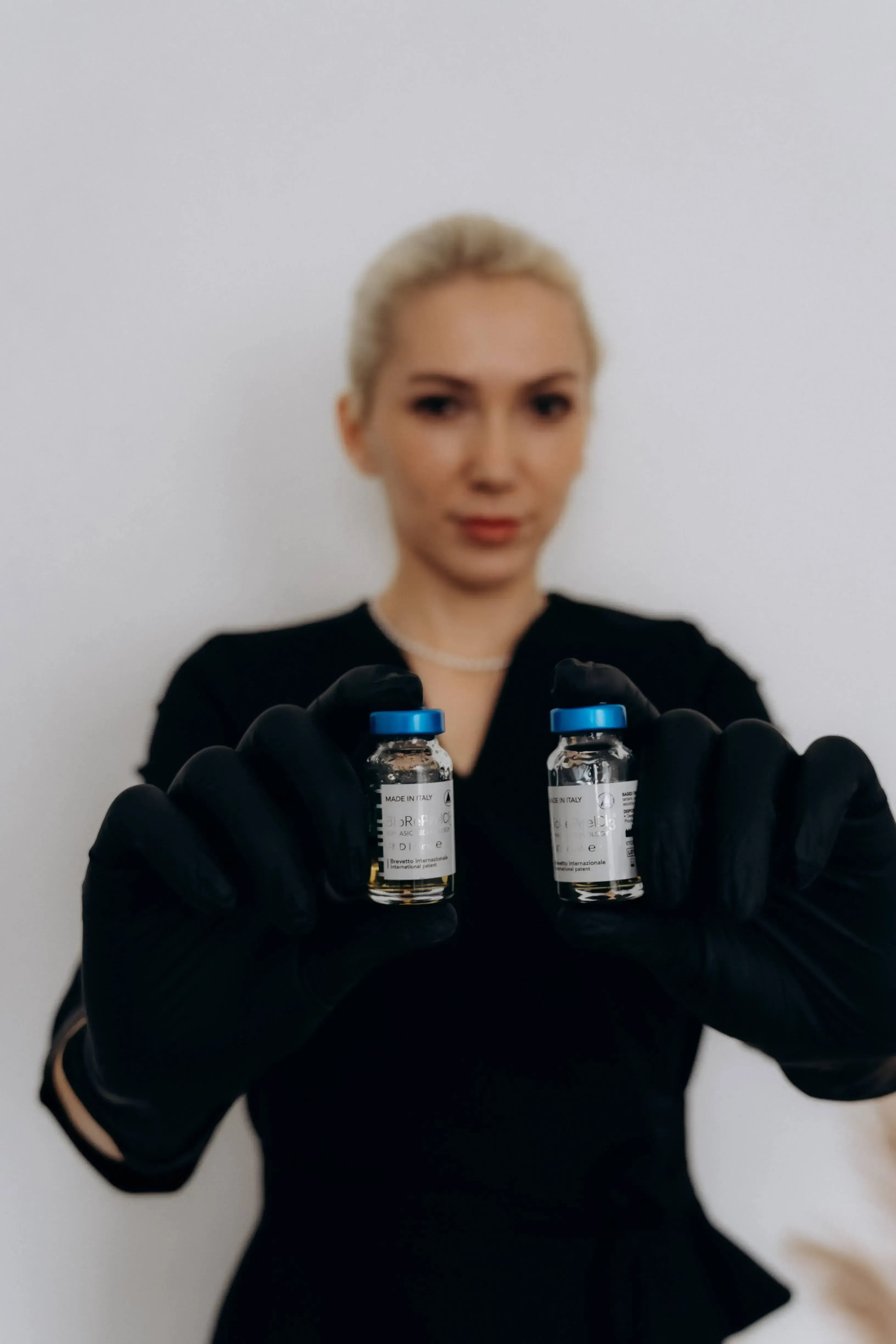 Serums used in treatments, held by the specialist